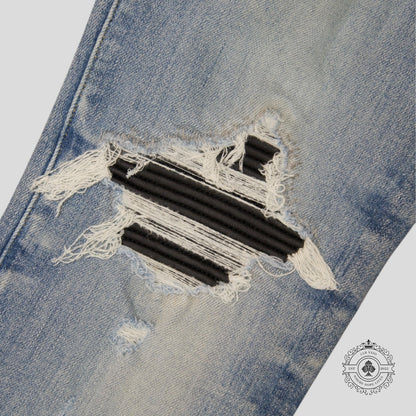 Amiri MX1 Leather Patch Jeans in Light Indigo