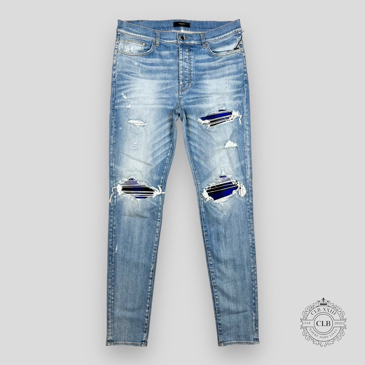 AMIRI PLAID THRASHER JEANS - LIGHT INDIGO
