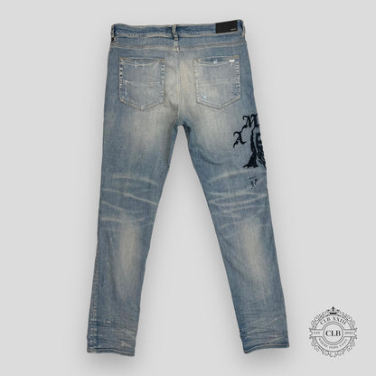 AMIRI X WES LANG REAPER LOGO JEANS - CLAY INDIGO